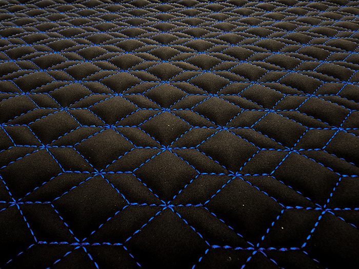Qbert stitch pattern on black with blue thread