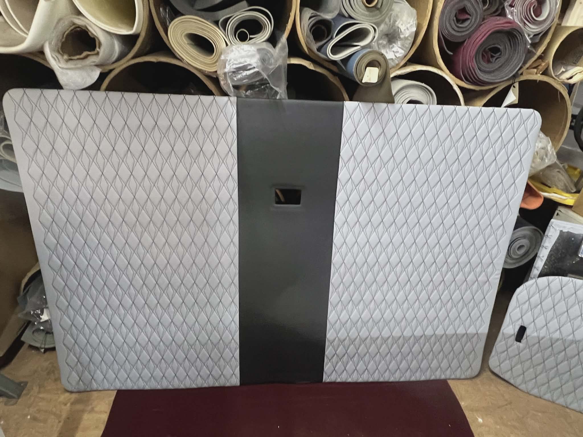 Custom vehicle headliner upholstered with grey material and black Diamond in Diamond stitching