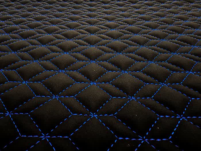Qbert stitch pattern on black with blue thread