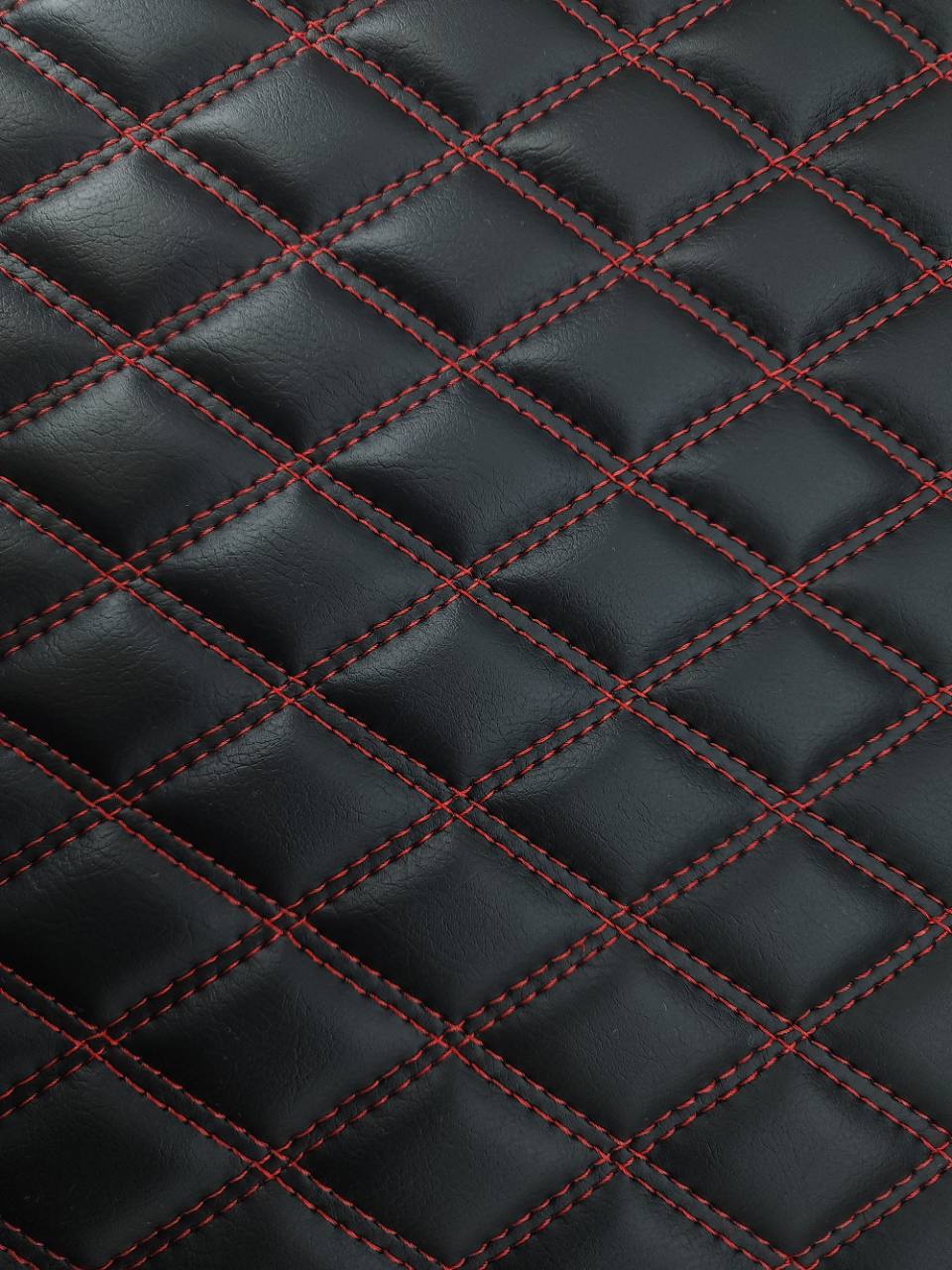 Double Diamond Vertical stitch detail in black Pinnacle 909 Raven vinyl with Red 7905U thread