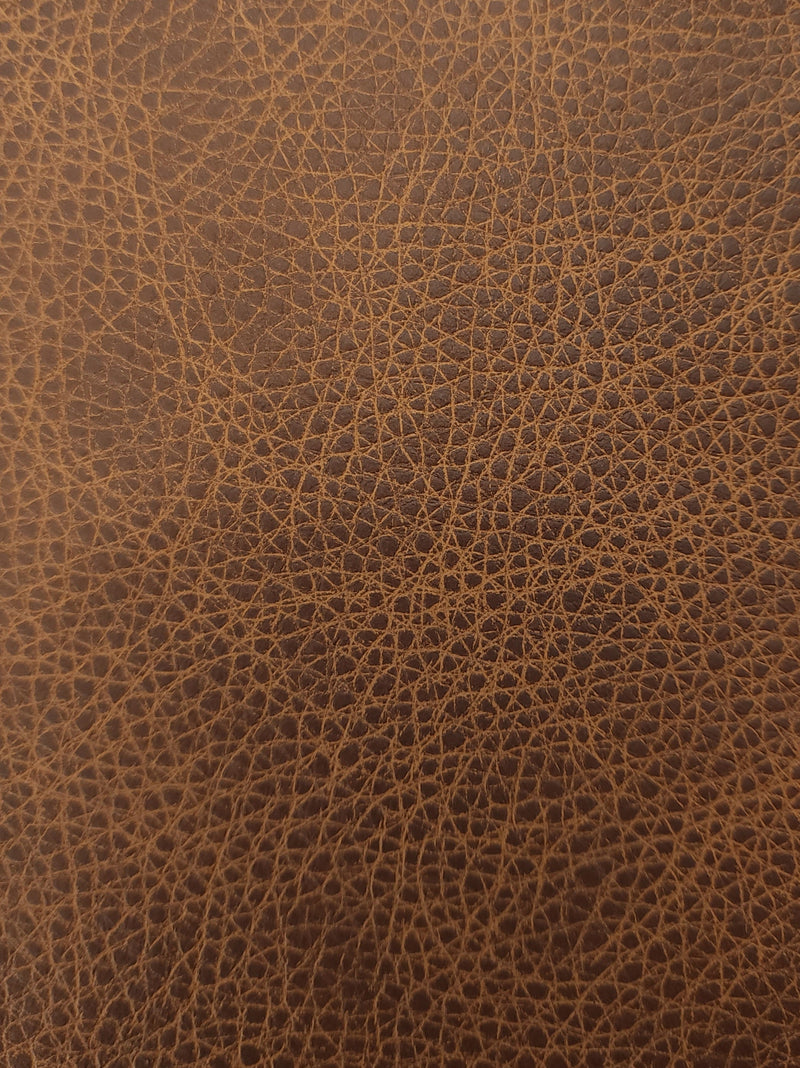 Roadhouse leather in Cognac — material reference; sample deck contains all 14 colors. Physical deck not pictured.