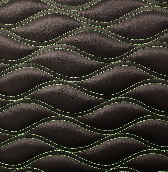 Wave stitch pattern on black with green thread