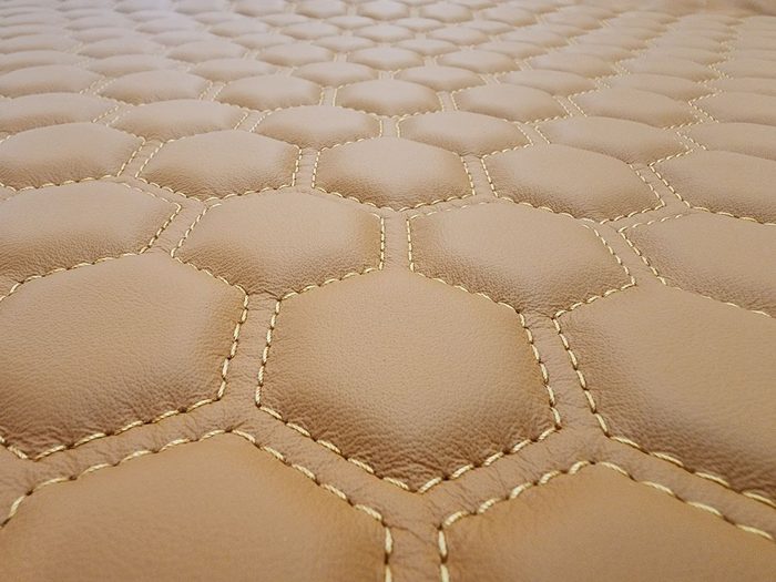 Hexagon stitch pattern on saddle tan vinyl