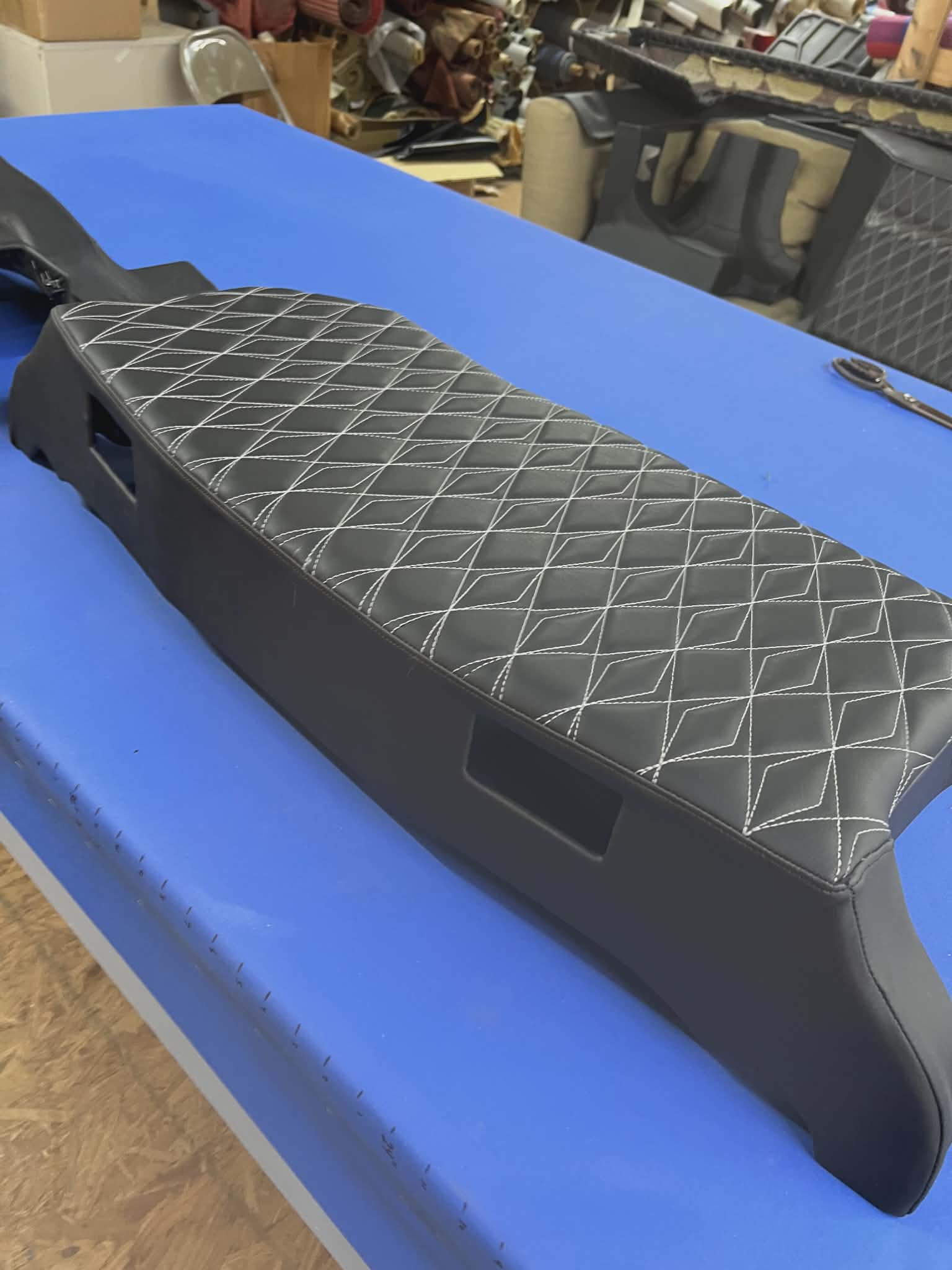 Automotive interior upholstered with Diamond in Diamond CNC sewn panel, black vinyl with grey stitching