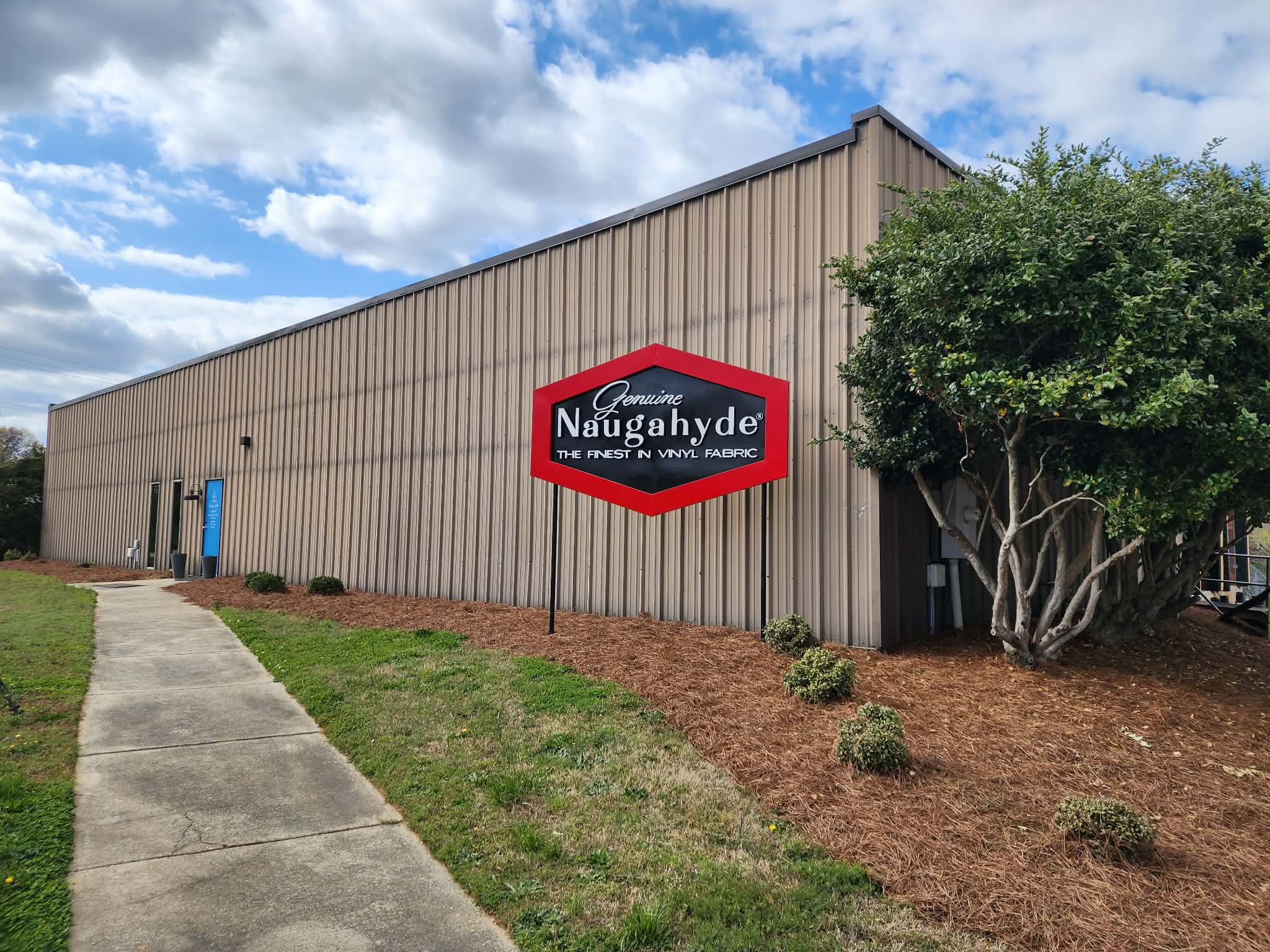 Original Naugahyde sign at Carolyn Fabrics - authorized vendor since 1932