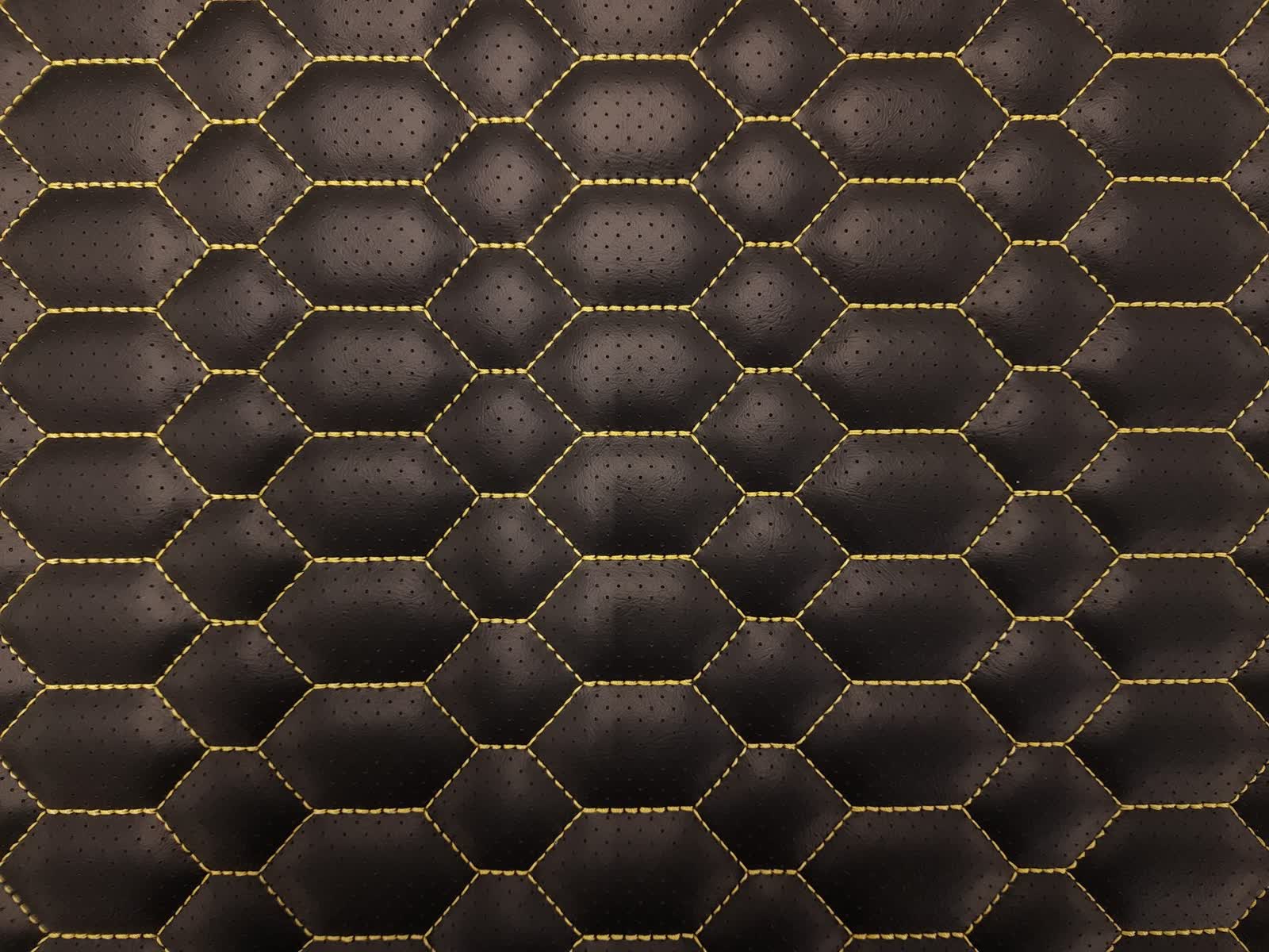 CNC beehive stitch pattern on black vinyl with gold thread