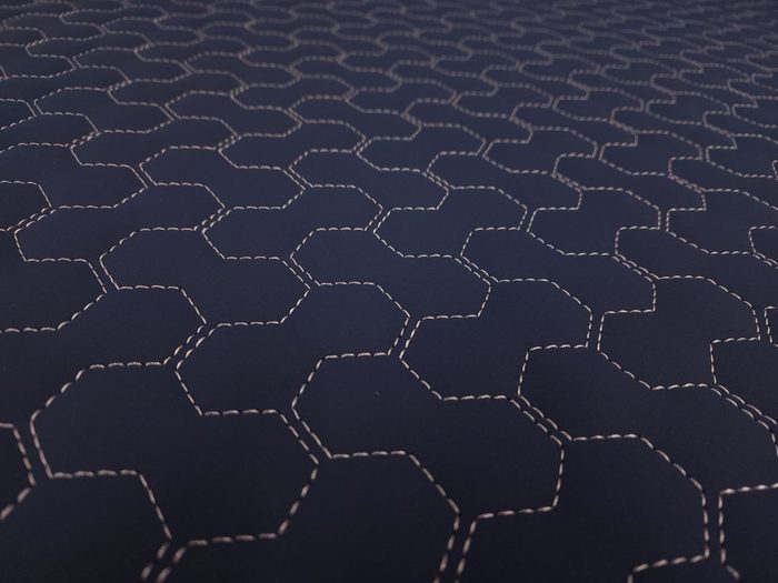 Hex cell stitch pattern on navy vinyl