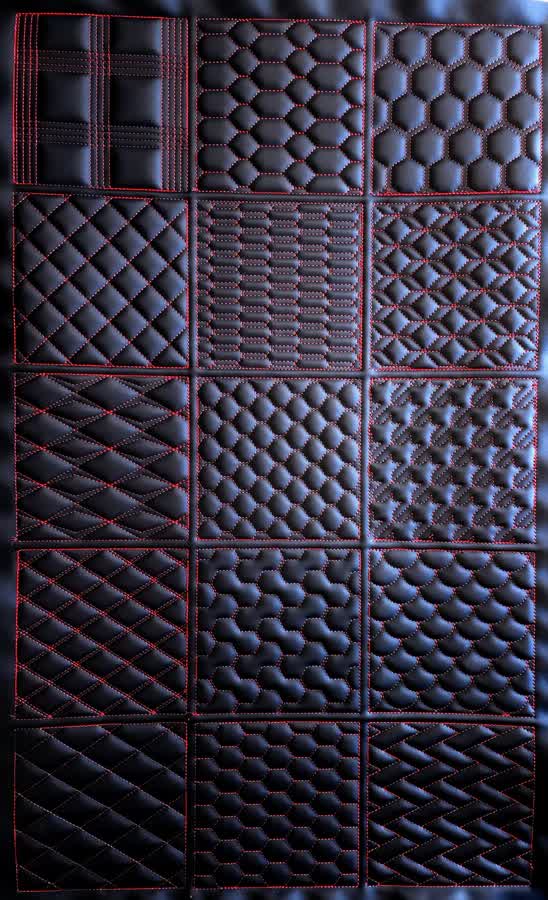 Shop Display Panel showing 15 CNC stitch patterns on black vinyl